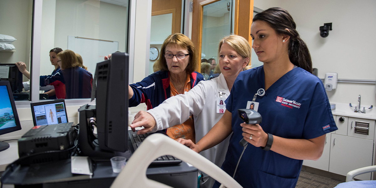 Nursing Staff and Student Working Together
